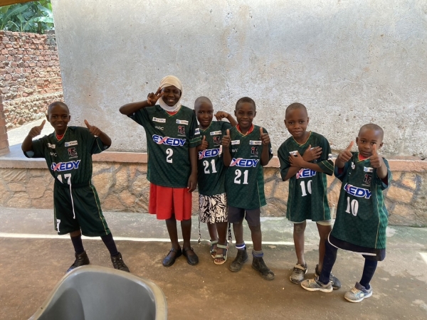 [ soccer uniforms ] [ Uganda ] They are wearing uniforms with smile.