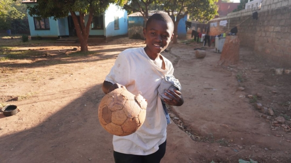 [ soccer ball ] [ Uganda ] They have old ball. This shows why they need balls.